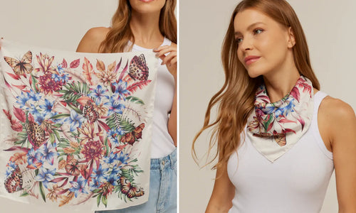 Modelo posando em fundo neutro exibindo lenço estampado da Scarf Me.